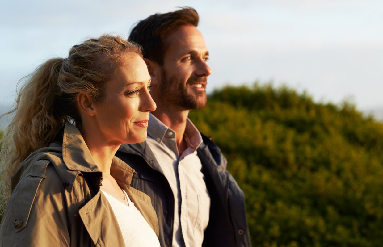 White couple in their 40s looking ahead